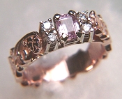 Bridged ring with sculpted ivy pattern and emerald cut pink sapphire