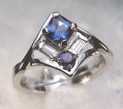 Custom platinum ring set with a square blue sapphire, diamond baguettes and a round purple sapphire
