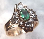 Diamond & oval emerald ring