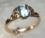14KY Celtic Vanessa Ring with a 7x5mm emerald cut aquamarine